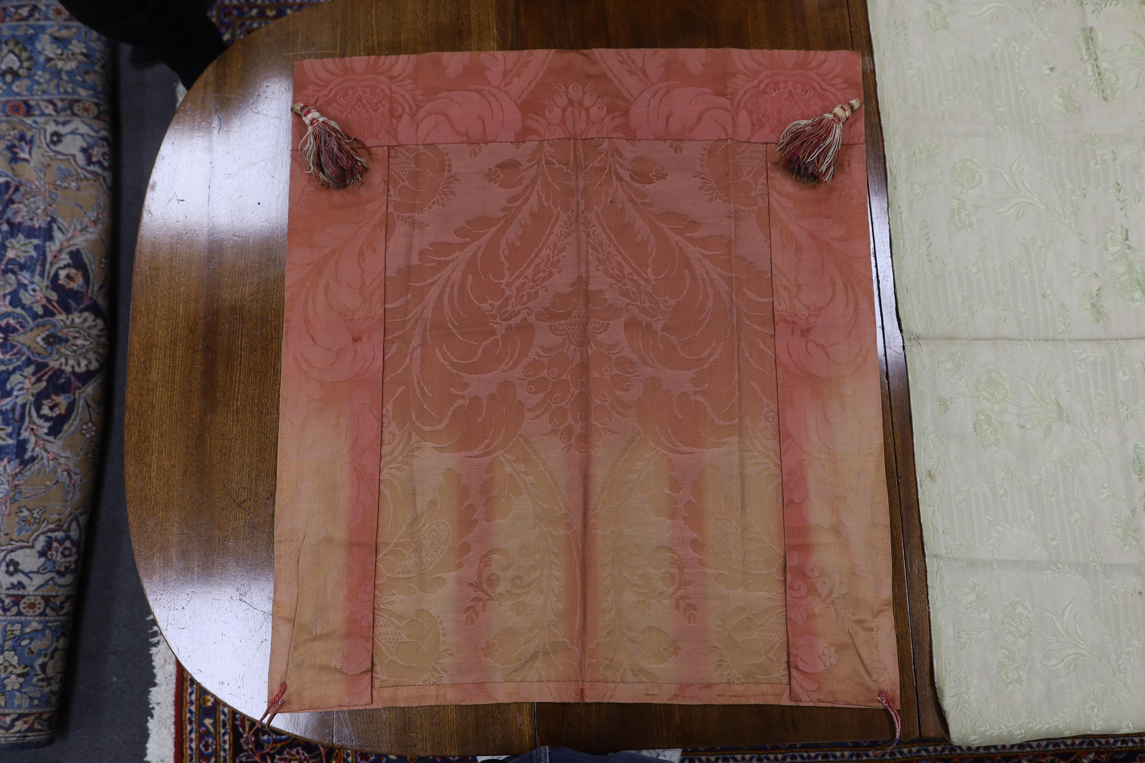 Three panels of 19th century silk, two silk brocade, one silk damask together with a panel of 1930’s silver woven geometric designed lame.